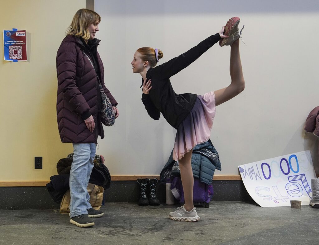 Two athletes playing baseball on the field