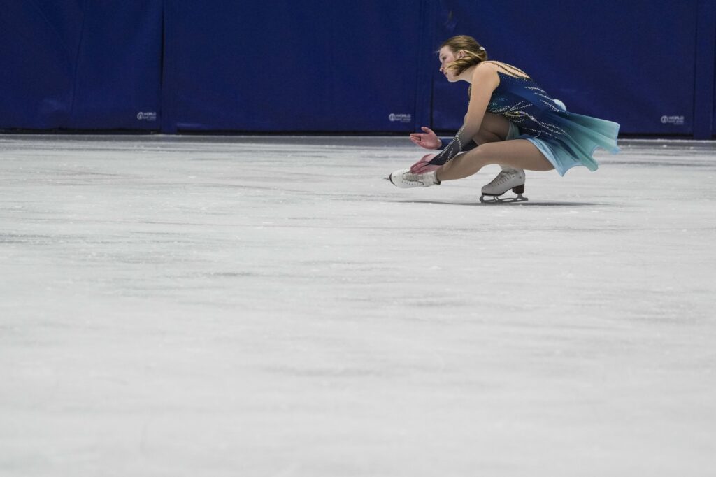 An athlete skating on the rink