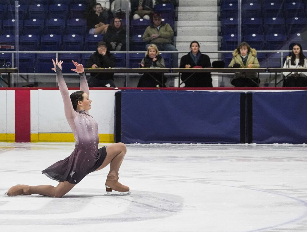 A group of athletes skating on the rink