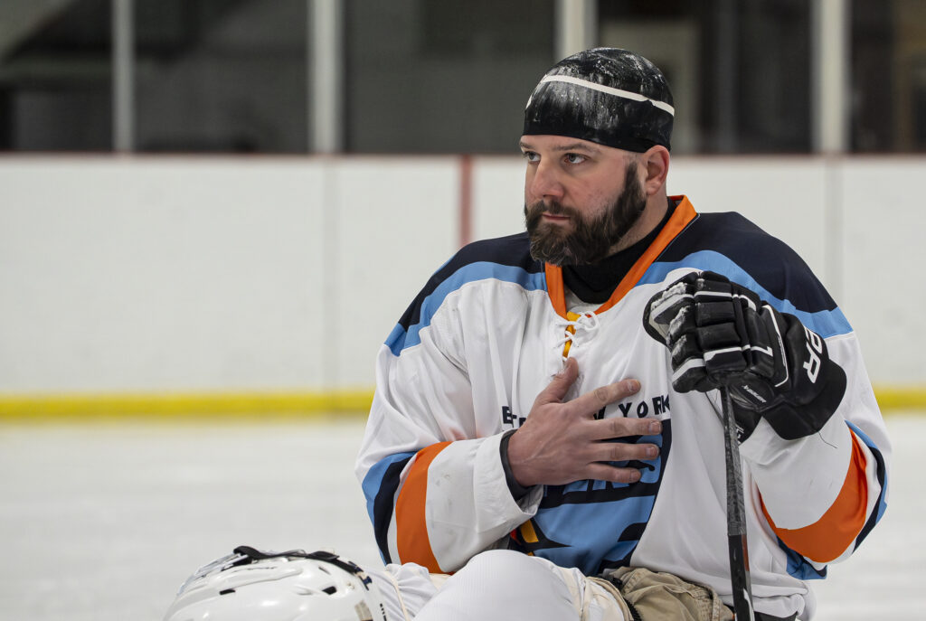 Two athletes competing in athletic event sports with helmet
