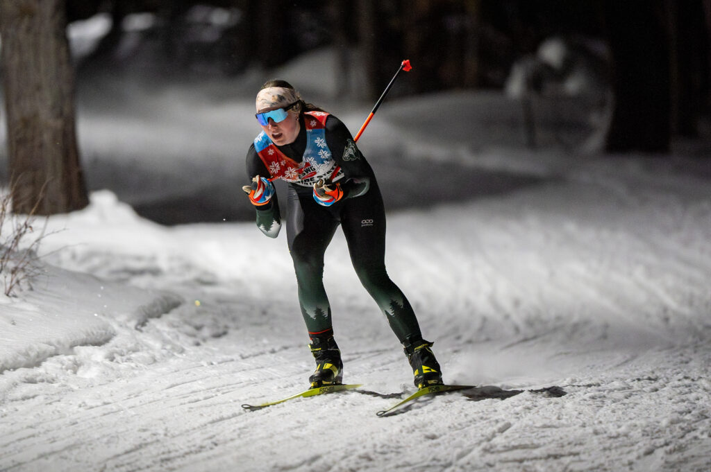 Two athletes skiing in the snow