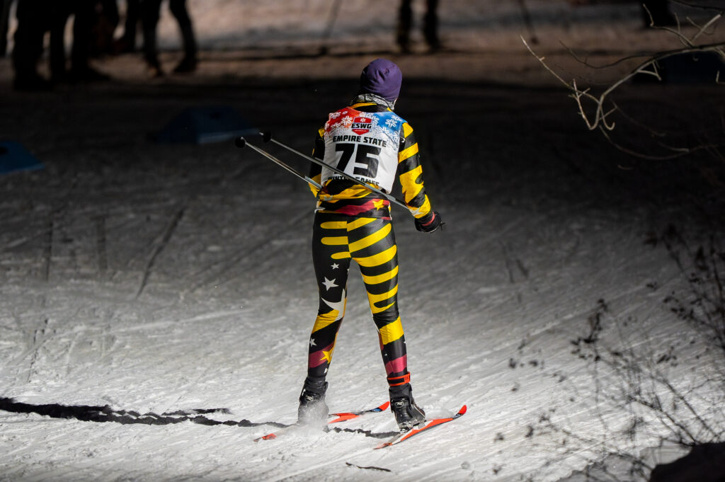 A group of athletes skiing in the snow