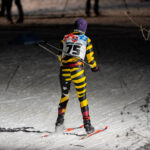 A group of athletes skiing in the snow
