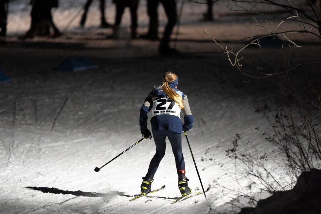 A group of athletes skiing in the snow