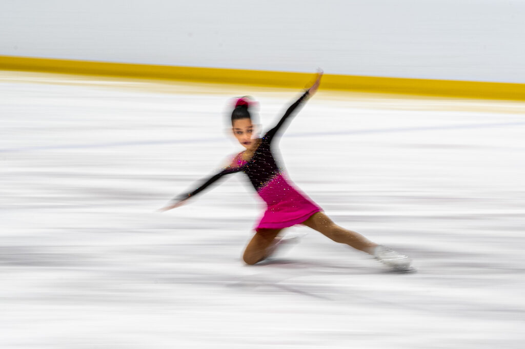 An athlete skating on the rink