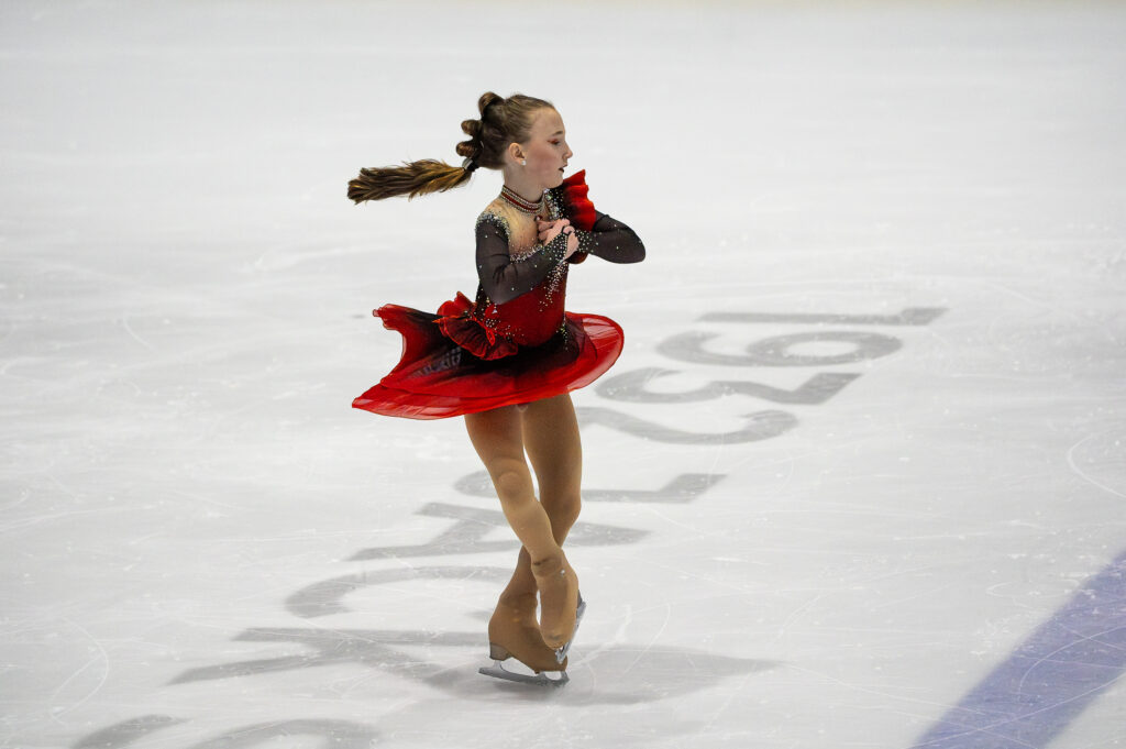 An athlete skating on the rink