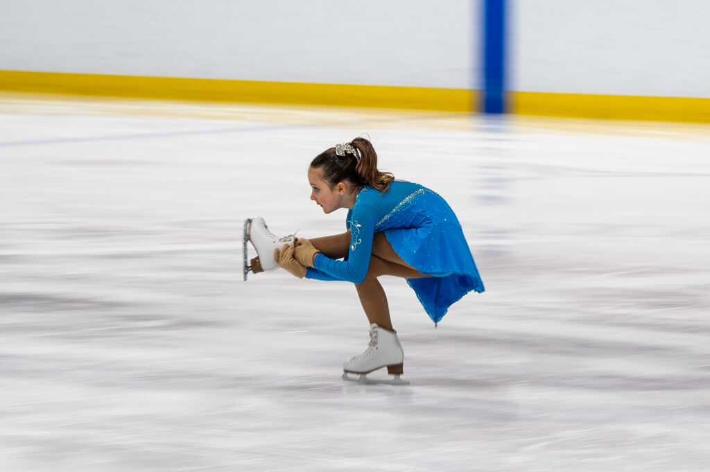 An athlete skating on the rink