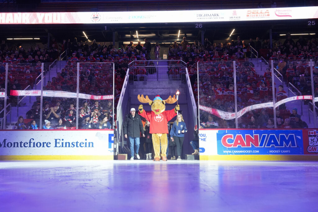 A group of athletes skating on the rink
