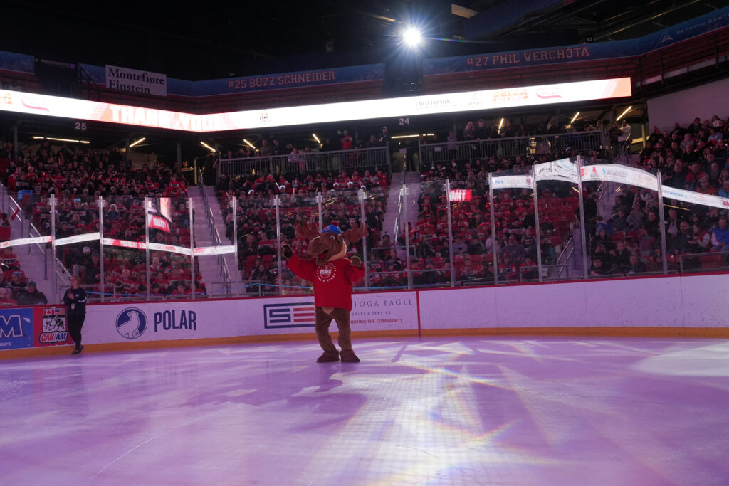 A group of athletes skating on the rink