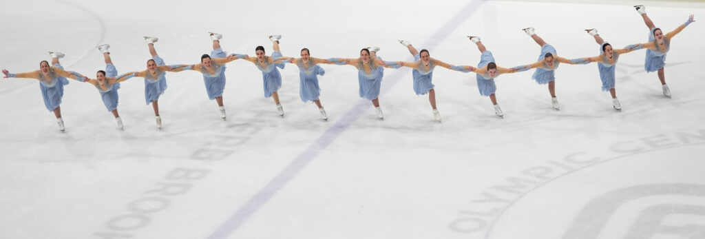 A group of athletes skating on the rink