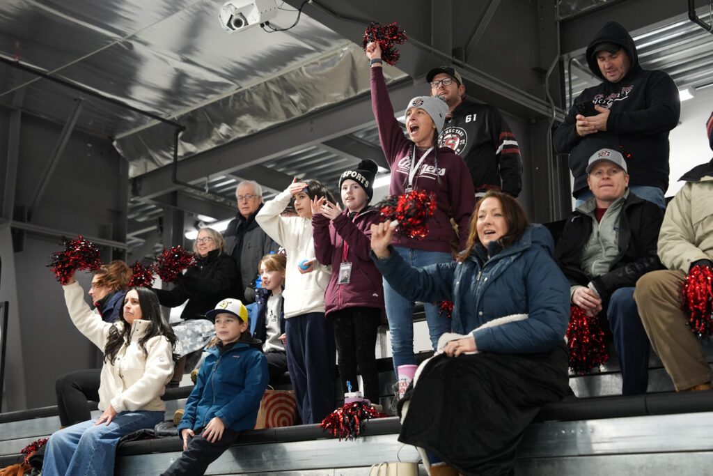 A group of athletes competing in athletic event sports