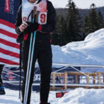 Two athletes competing in athletic event sports in the snow