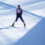 An athlete skiing in the snow