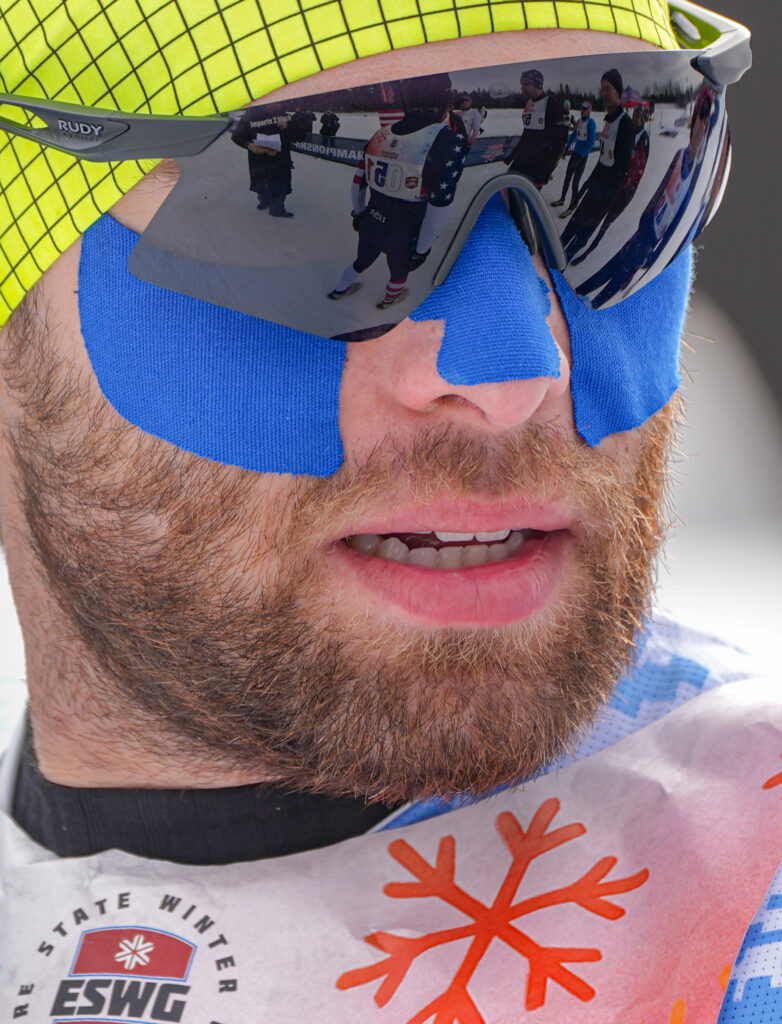 A group of athletes competing in athletic event sports with goggles and helmet