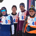 A group of athletes competing in athletic event sports