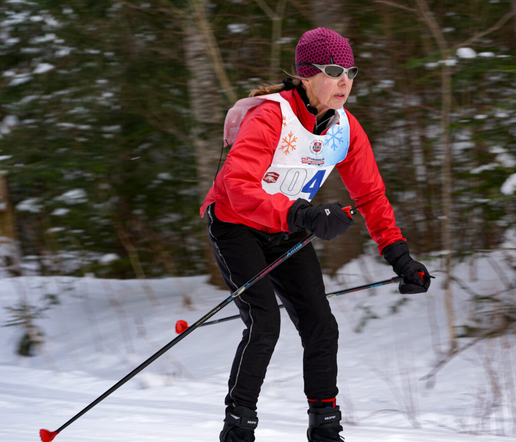 An athlete skiing in the snow