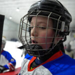 A group of athletes competing in athletic event sports with helmet