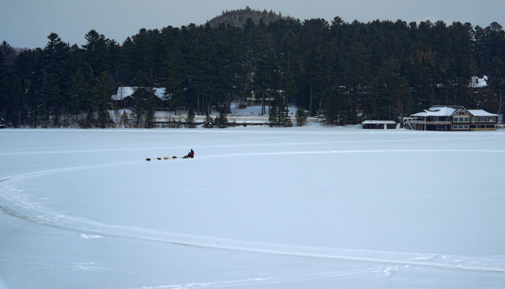 Two athletes competing in athletic event sports outdoors