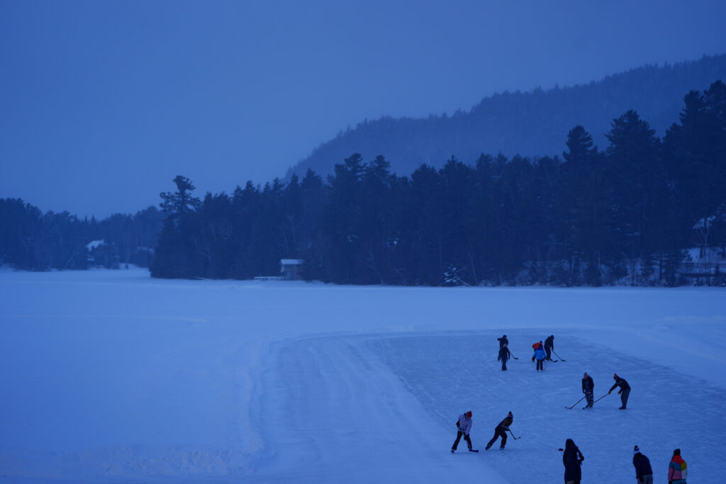 A group of athletes competing in athletic event sports with helmet in the snow