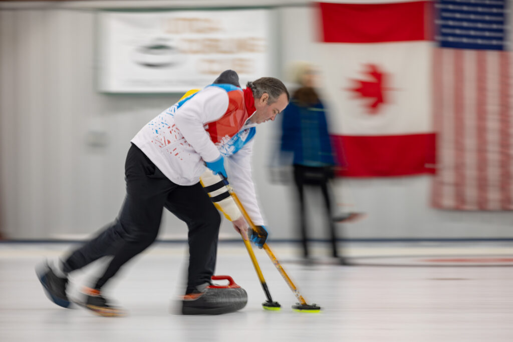 Two athletes competing curling