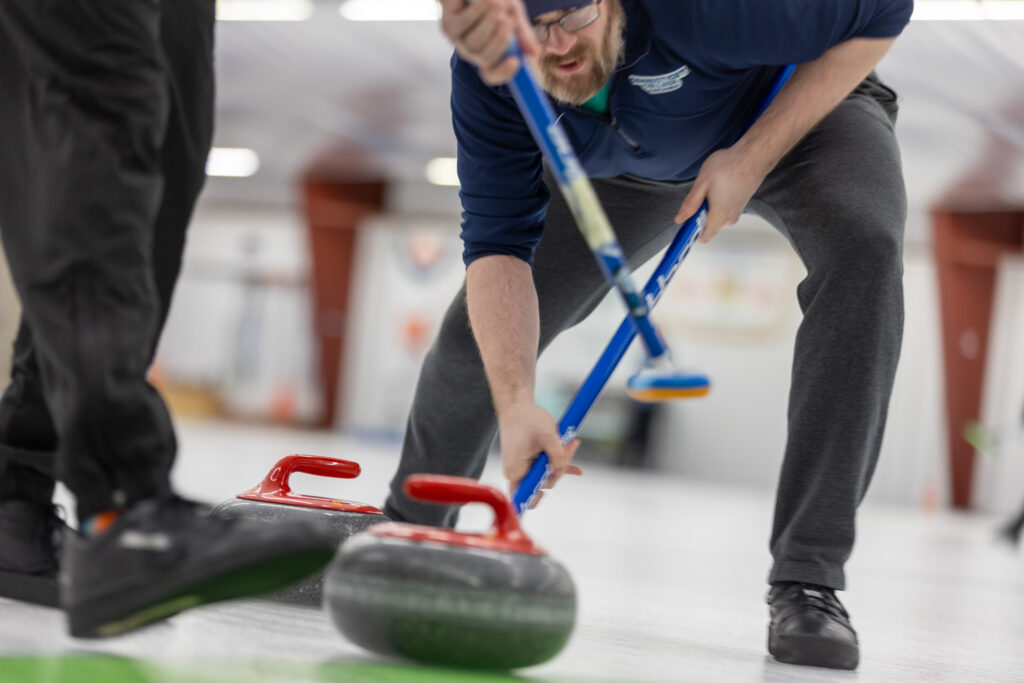 Two athletes competing curling