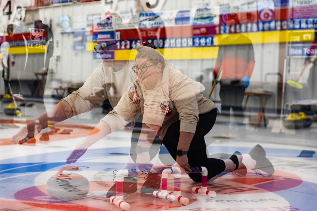 Two athletes competing curling
