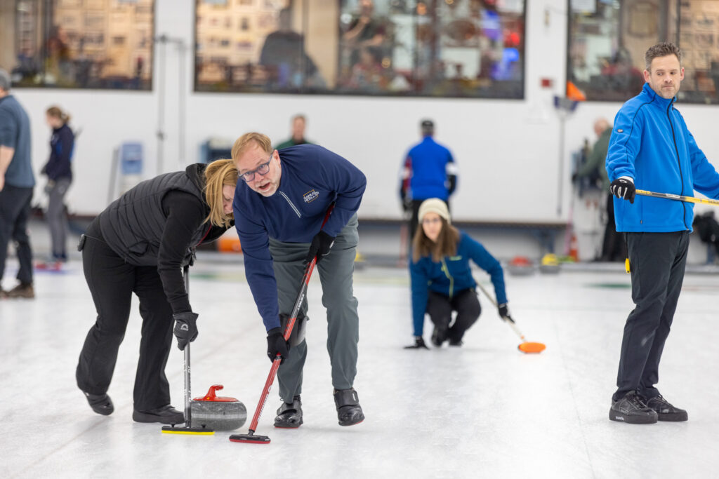 A group of athletes skating on the rink