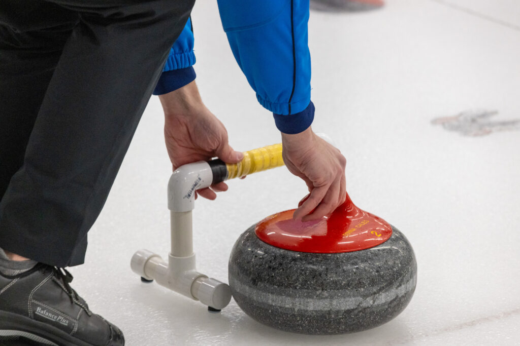 An athlete competing curling