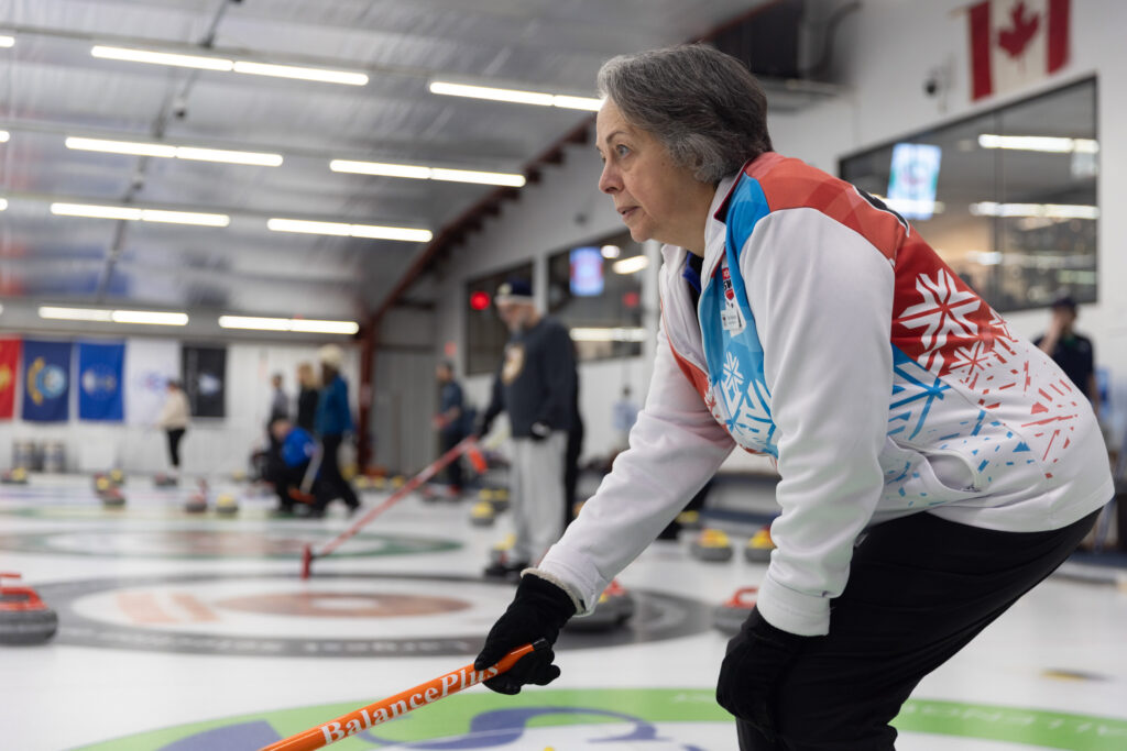 A group of athletes competing curling