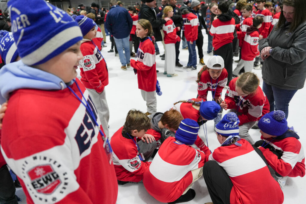A group of athletes competing in athletic event sports
