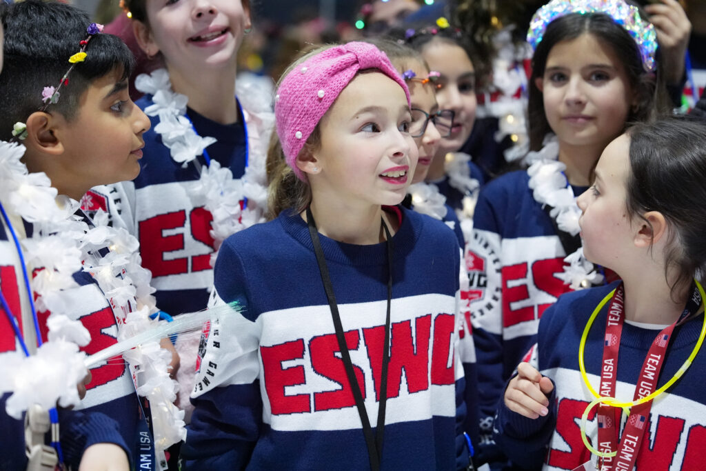 A group of athletes competing in athletic event sports