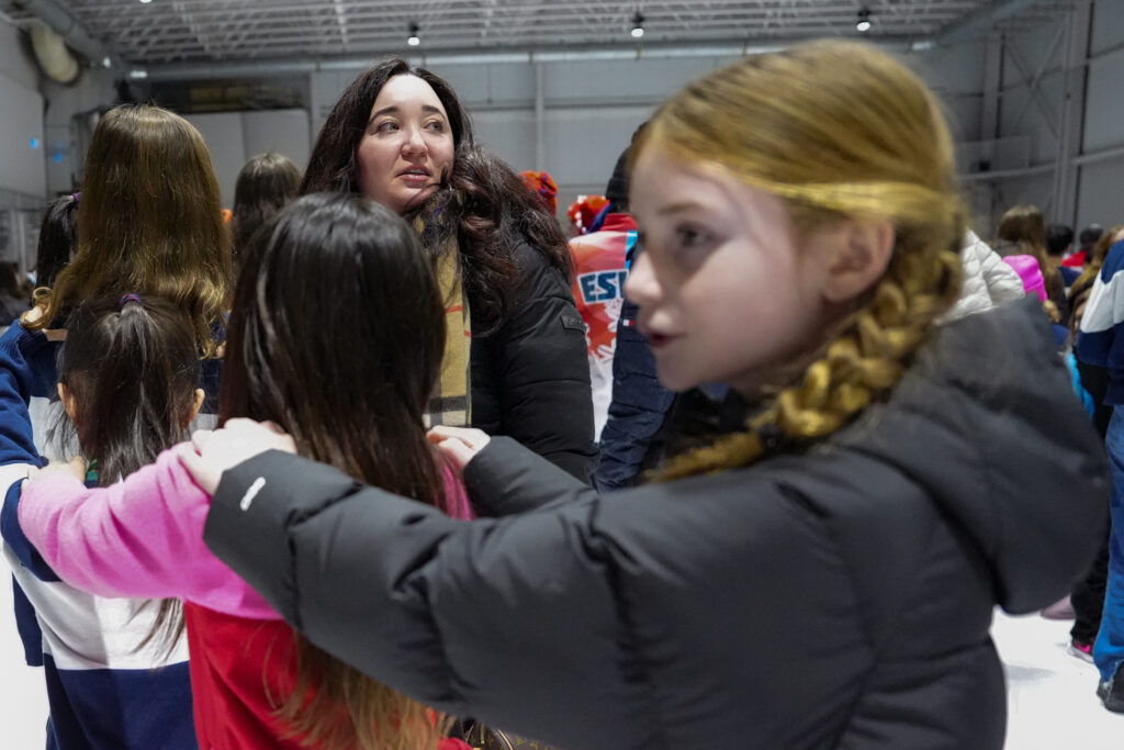 A group of athletes competing in athletic event sports