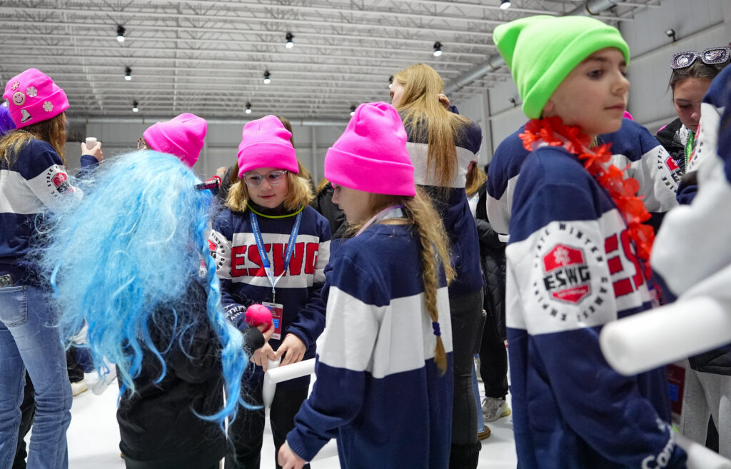 A group of athletes competing in athletic event sports