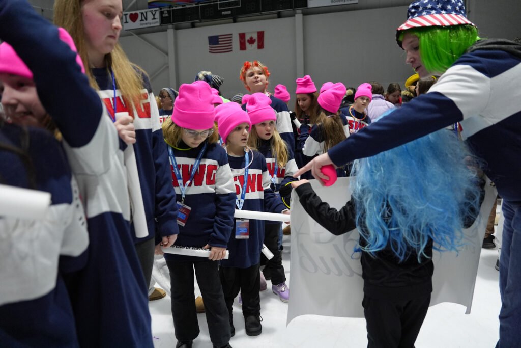 A group of athletes competing in athletic event sports