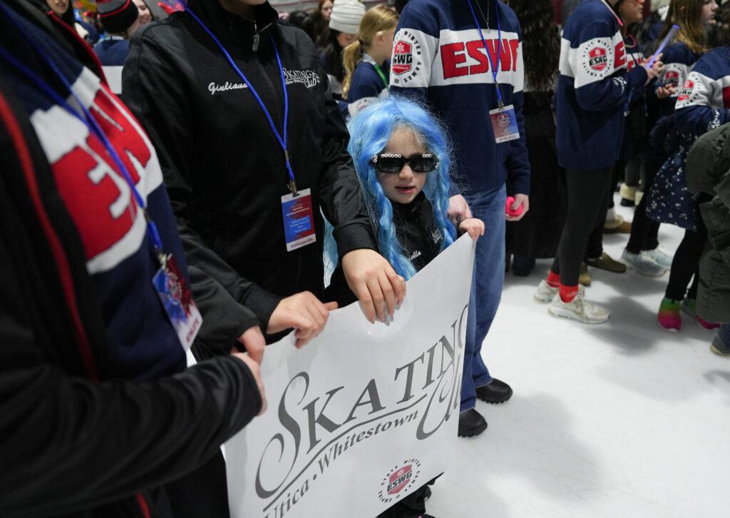 A group of athletes competing in athletic event sports