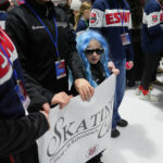 A group of athletes competing in athletic event sports