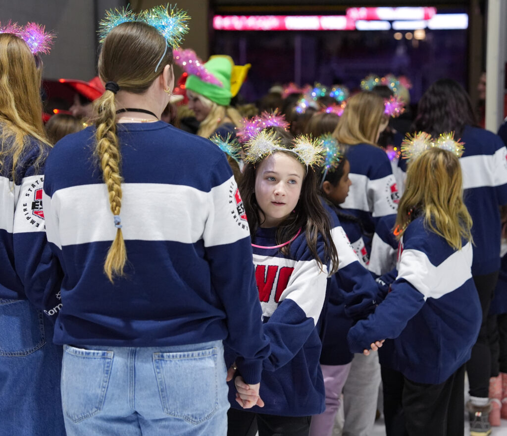 A group of athletes competing in athletic event sports