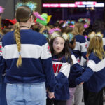 A group of athletes competing in athletic event sports