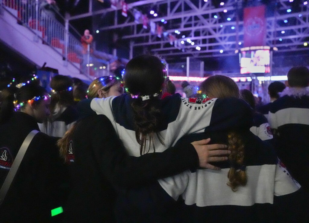 A group of athletes competing in athletic event sports