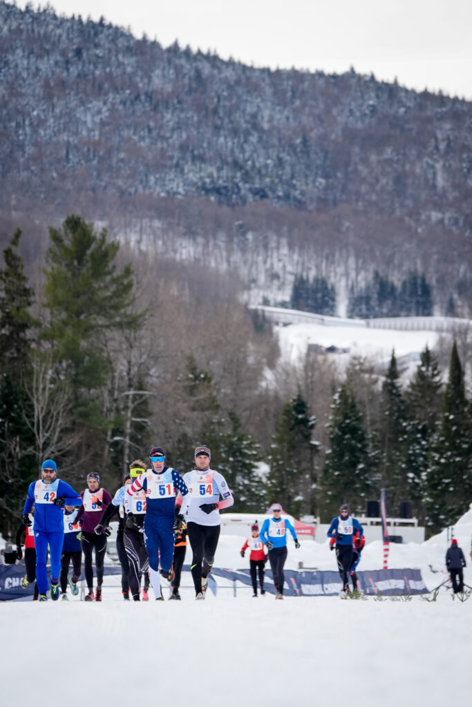 A group of athletes competing in athletic event sports in the snow