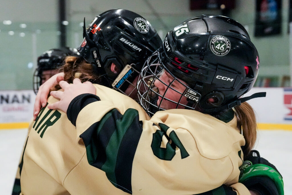 An athlete playing football with helmet on the field