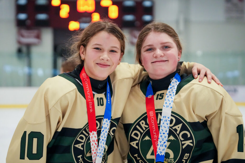 Two athletes competing in athletic event sports