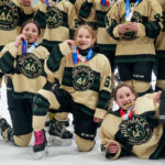 A group of athletes competing in athletic event sports