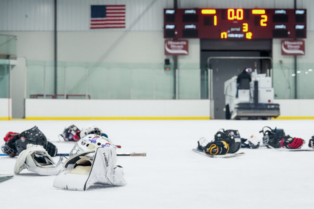 Two athletes competing in athletic event sports with helmet