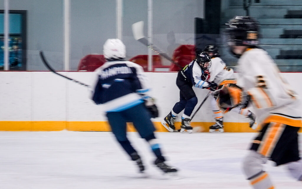 A group of athletes competing in athletic event sports with helmet