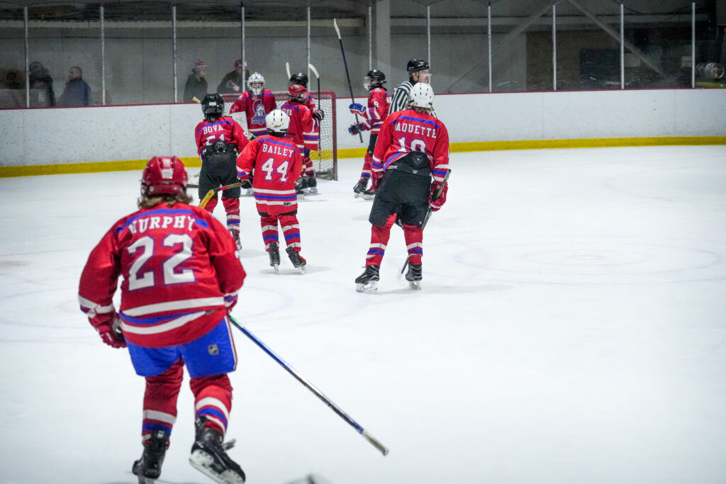 A group of athletes skating with helmet