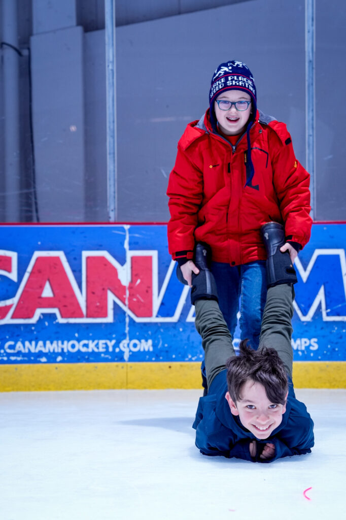 Two athletes skating on the rink