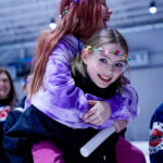 A group of athletes competing in athletic event sports