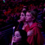 A group of athletes competing in athletic event sports