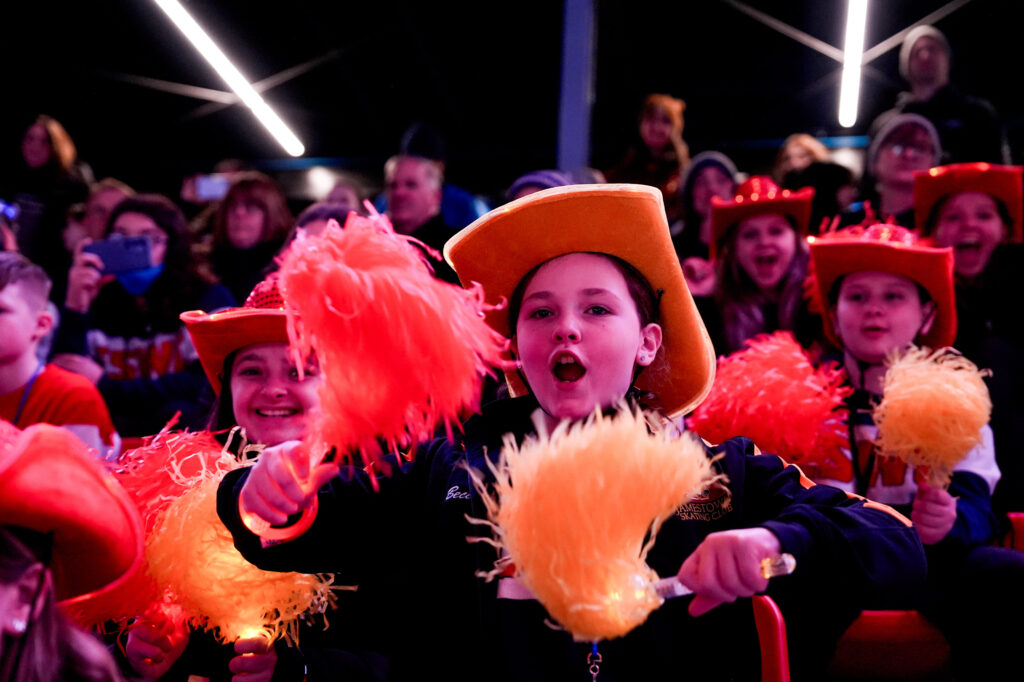 A group of athletes competing in athletic event sports